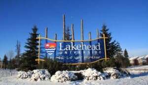 Universities - WEMS Lakehead University entrance sign in winter, Thunder Bay